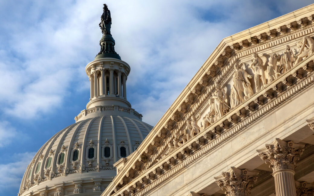 U.S. Capitol closeup of base relief and dome with Liberty statue