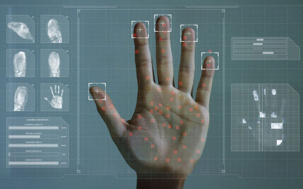 a hand pressed against a scanner with fingerprints being analyzed by the computer system and displaying in infographics and data panels